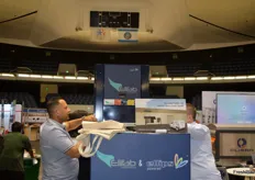 Some of the exhibitors, like the Ellips Group, had their booth placed in the middle of what normally is a basketball stadium. Just look at the score board and the grandstands.